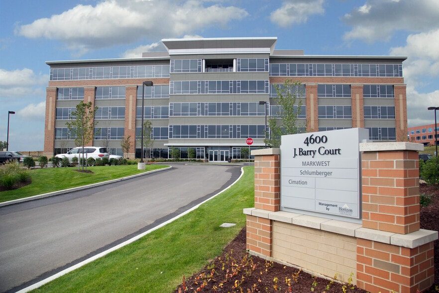 Entrance drive and monument sign at 4600 J. Barry Court, listing tenants MarkWest, Schlumberger and Cimation
