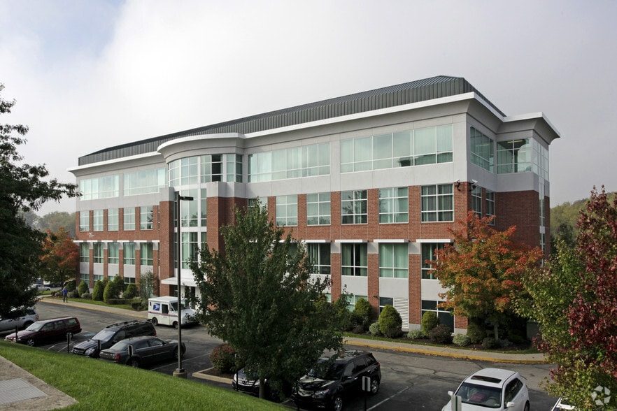 Horizon Financial Center, a three-story brick and glass office building with a curved corner entry