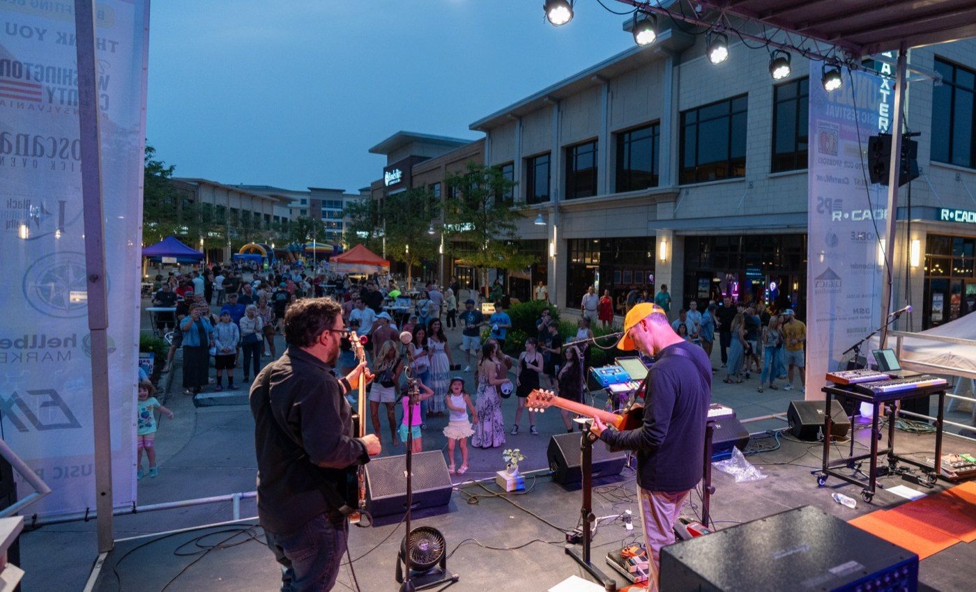Sunset Music Festival packing Main Street at Southpointe Town Center, seen from the stage